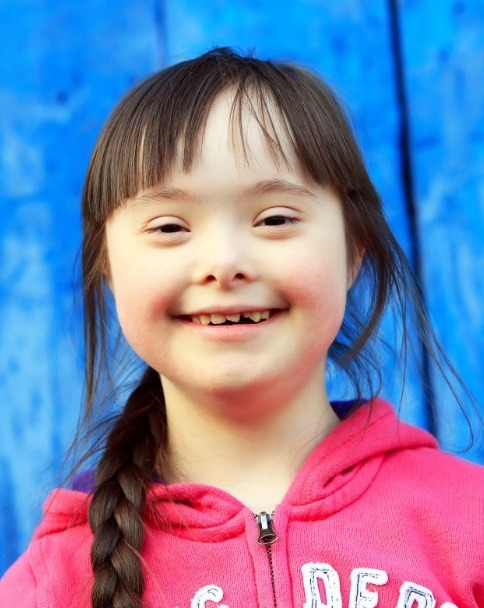 Young girl with special needs smiling