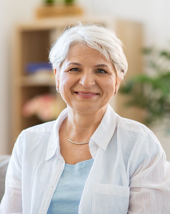 Senior woman sitting on couch