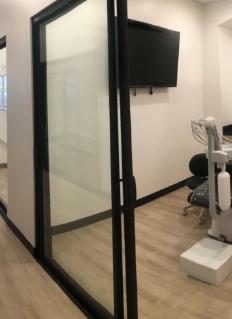 Glass door to dental treatment room