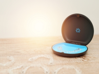 An open, round invisalign case representing a Diamond Invisalign Provider.