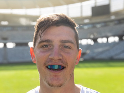 Man wears athletic mouthguard