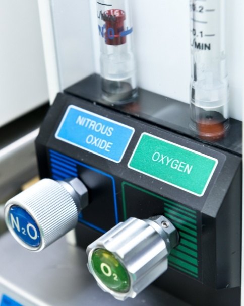 Nitrous oxide and oxygen buttons on machine for sedation dentistry in Mesquite