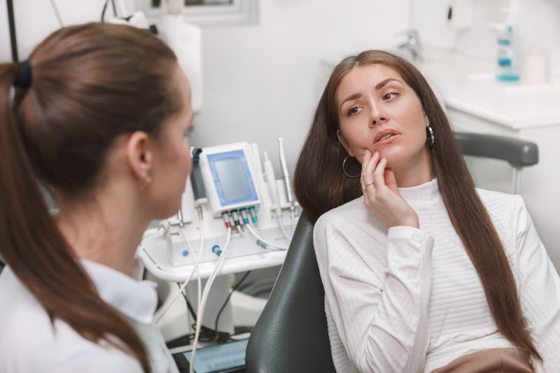 Patient panicking about loose dental implants